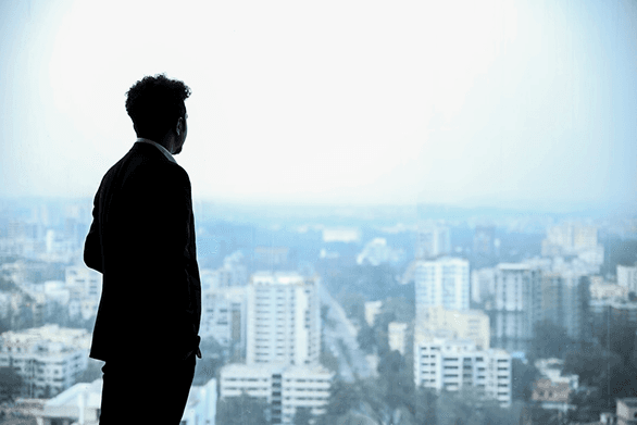 Business person looking at building